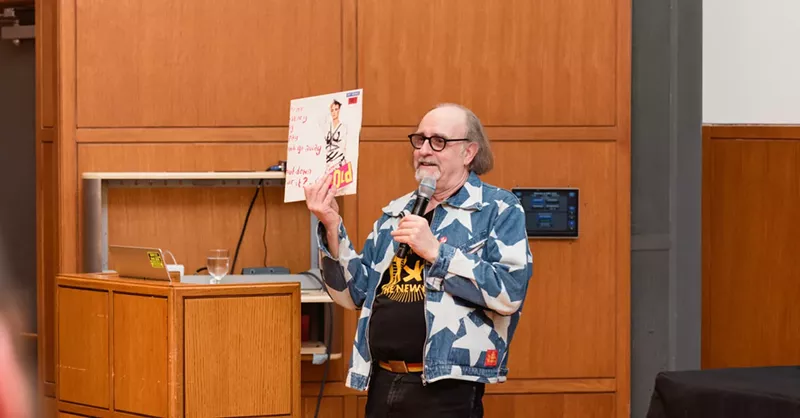 Image: The legendary Malcolm Garrett, wearing a Vivienne Westwood design, speaking at the punk exhibition Torn Apart , currently on display in Dallas.