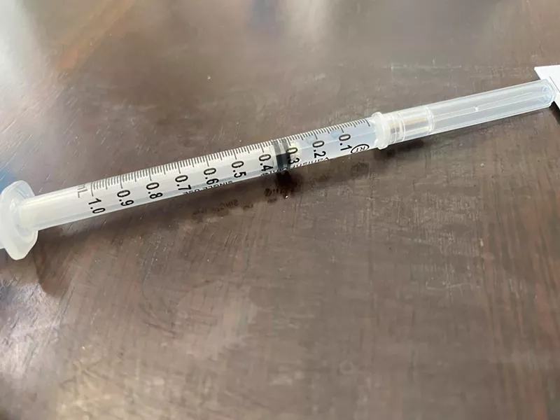 Image: A COVID-19 vaccination shot recently administered at a longterm care facility.