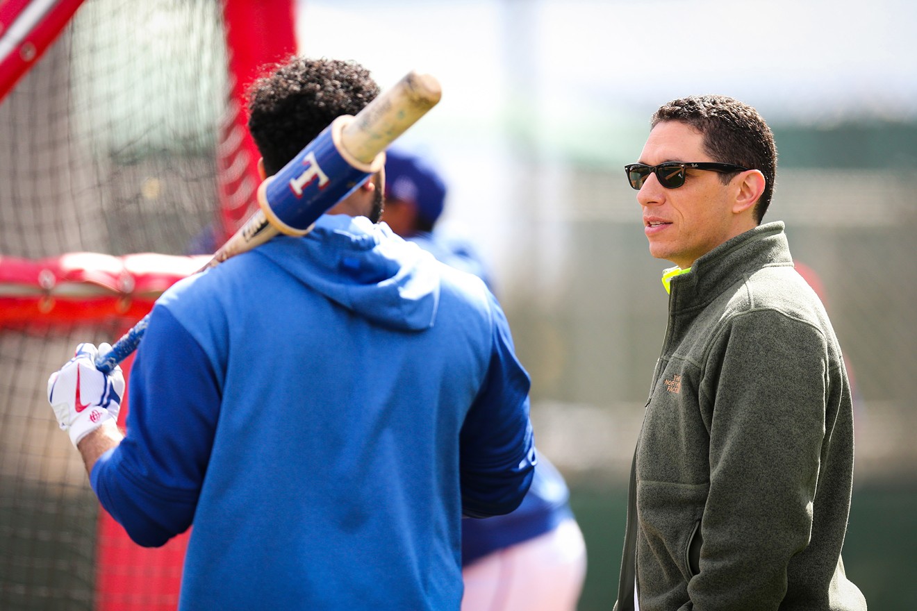 Jon Daniels (right), talking with Elvis Andrus, will no doubt be dealing at the deadline, one way or another.