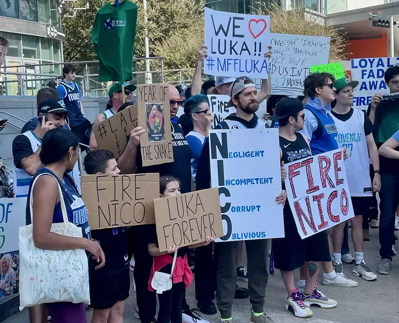 Image: Fans gathered in Victory Plaza mad about the recent Luka Doncic trade.