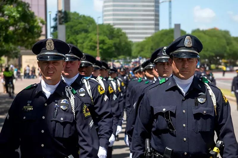 Image: Dallas police march in formal attire at the memorial event in 2017.