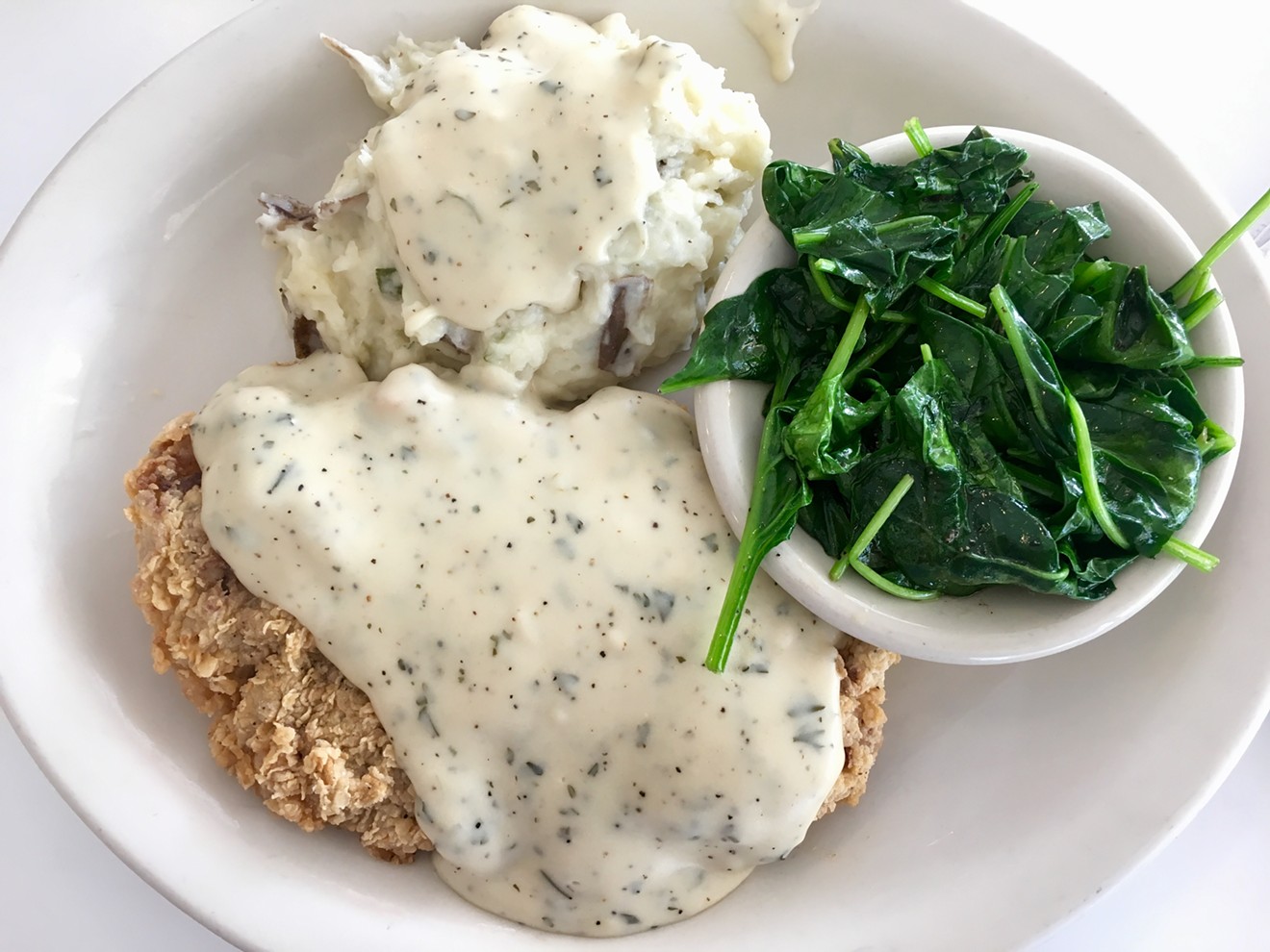 For less than 11 bucks, a chicken-fried steak, spinach from Oak Hill Farms in Poteet, Texas, and delicious mashed potatoes with red-eye gravy.
