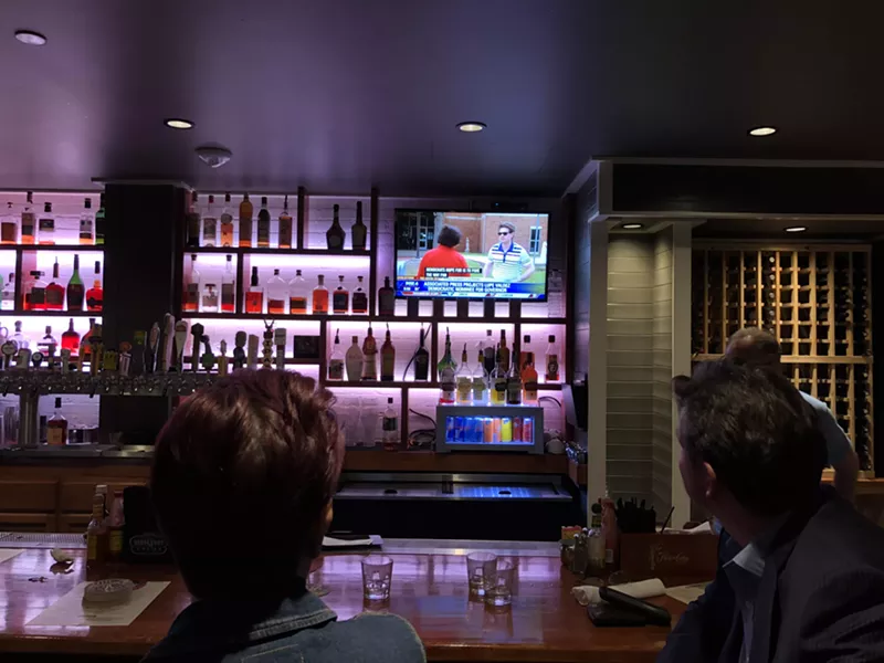 Image: Lupe Valdez supporters watch a local news channel report that Valdez would win the runoff against Andrew White. The Valdez watch party was at Ellen's in West End.