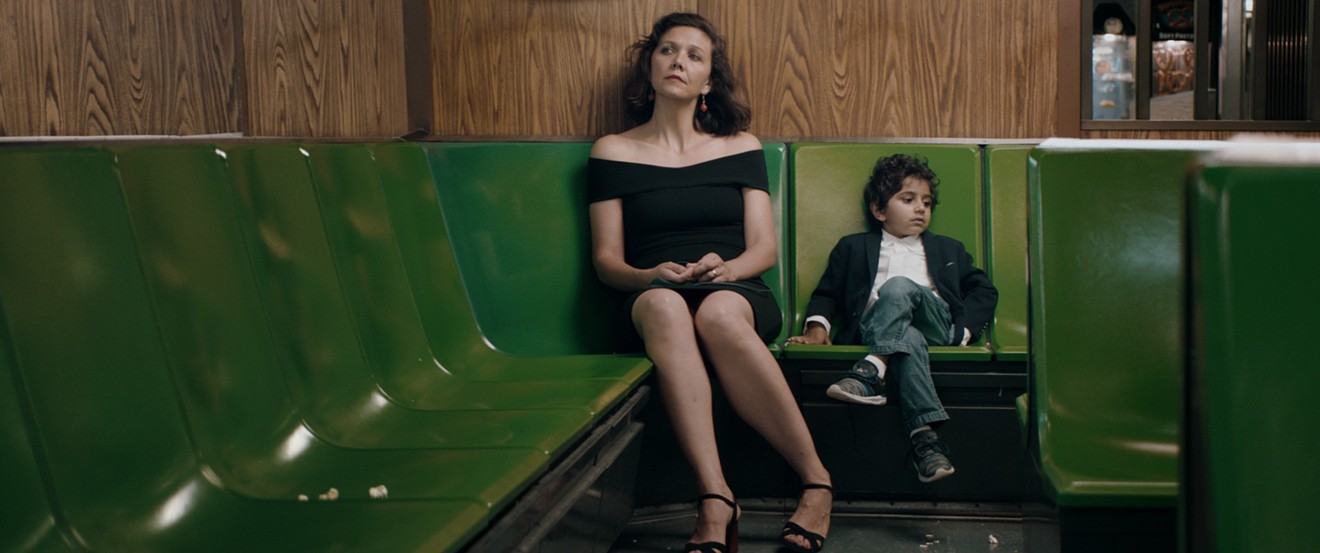 In Sara Colangelo’s The Kindergarten Teacher, Maggie Gyllenhaal (left) plays Lisa, the title character, who takes an insistent interest in the life and (apparent) art of five-year-old student Jimmy (Parker Sevak).