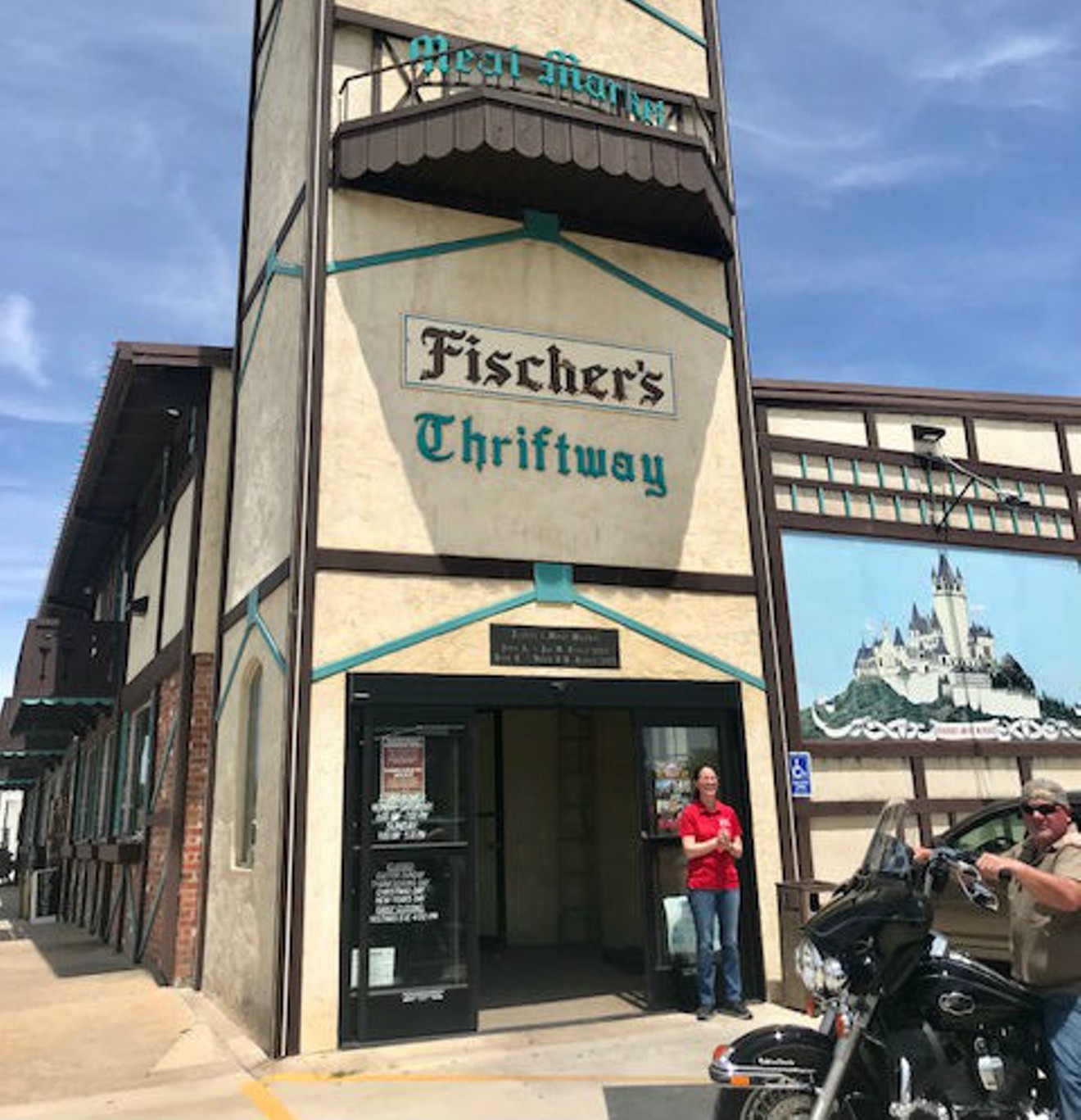 Penny Fischer, a member of the family that's owned Fischer's Meat Market since 1927, photographed in front of the quaint German-style meat market.