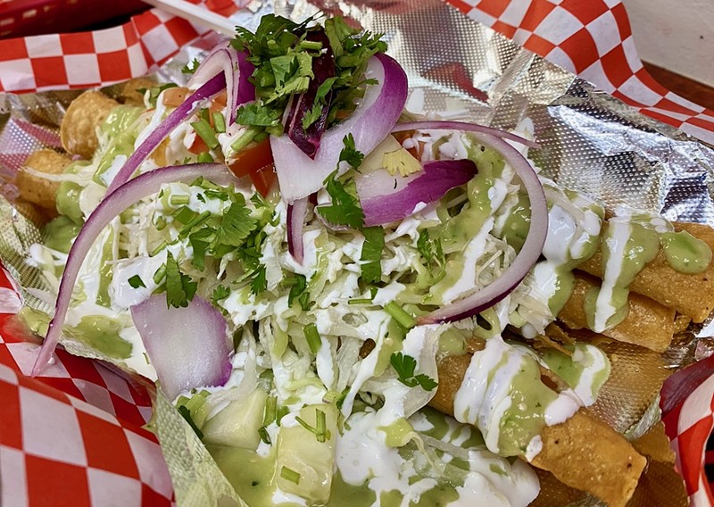 The flautas at Mami Coco are the star of the show, perfectly crisp and topped with a bright salad and sauces.