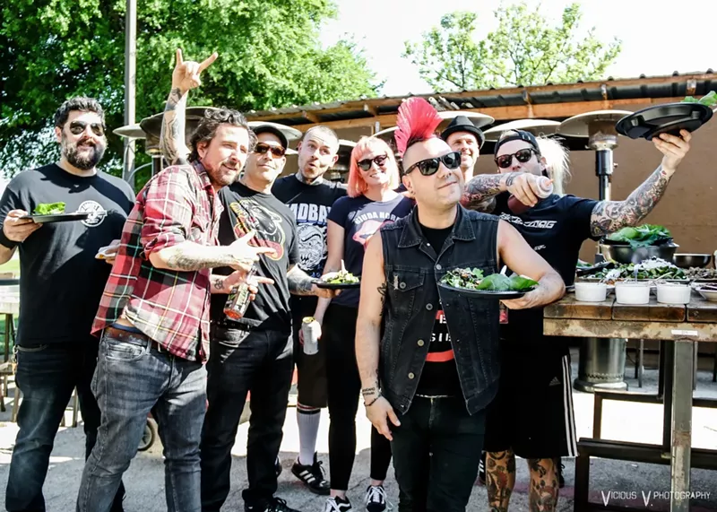 Image: Justin Box (center, back) is becoming the go-to chef for many punk bands that make their way to Dallas. Here he had prepared a meal for the Casualties and the Bouncing Souls.