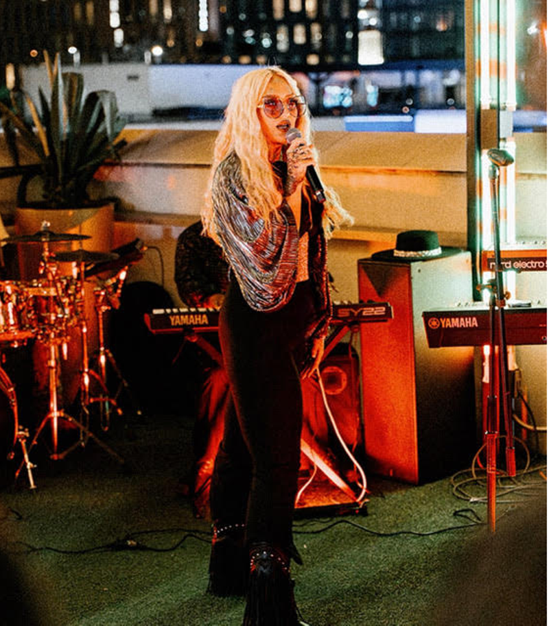 Image: A woman hosting an open mic