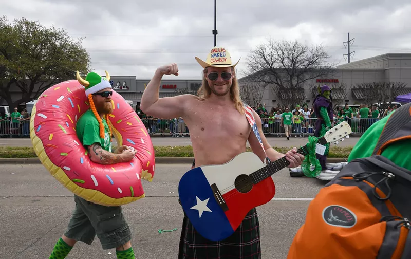 Image: Paul Allen, the Dallas Naked Cowboy, shows off his stuff at the St. Patrick's Day Parade.