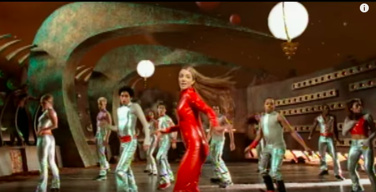Nick Florez dancing to Britney Spears' right in the "Oops! ... I Did It Again" video.