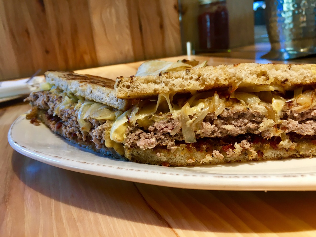 The patty melt is served morning, noon and night at Overeasy. It comes with housemade chips and a pickle for $14.