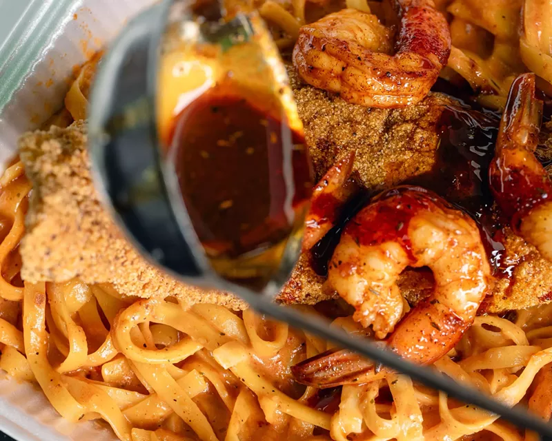 Image: Chef Rassaun "RJ" Johnson has created pasta and seafood dishes, among other delicacies, for the menu.