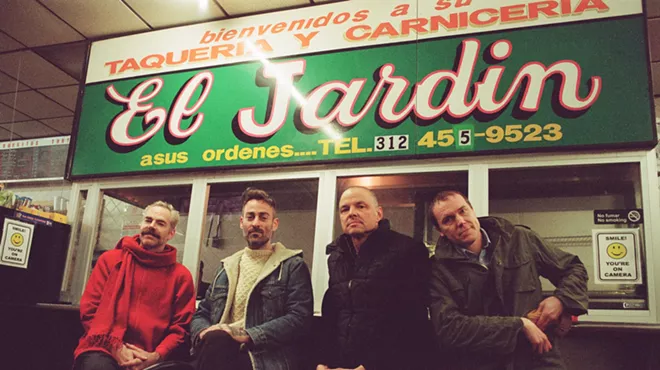 This is a photo of guys standing in front of a restaurant.