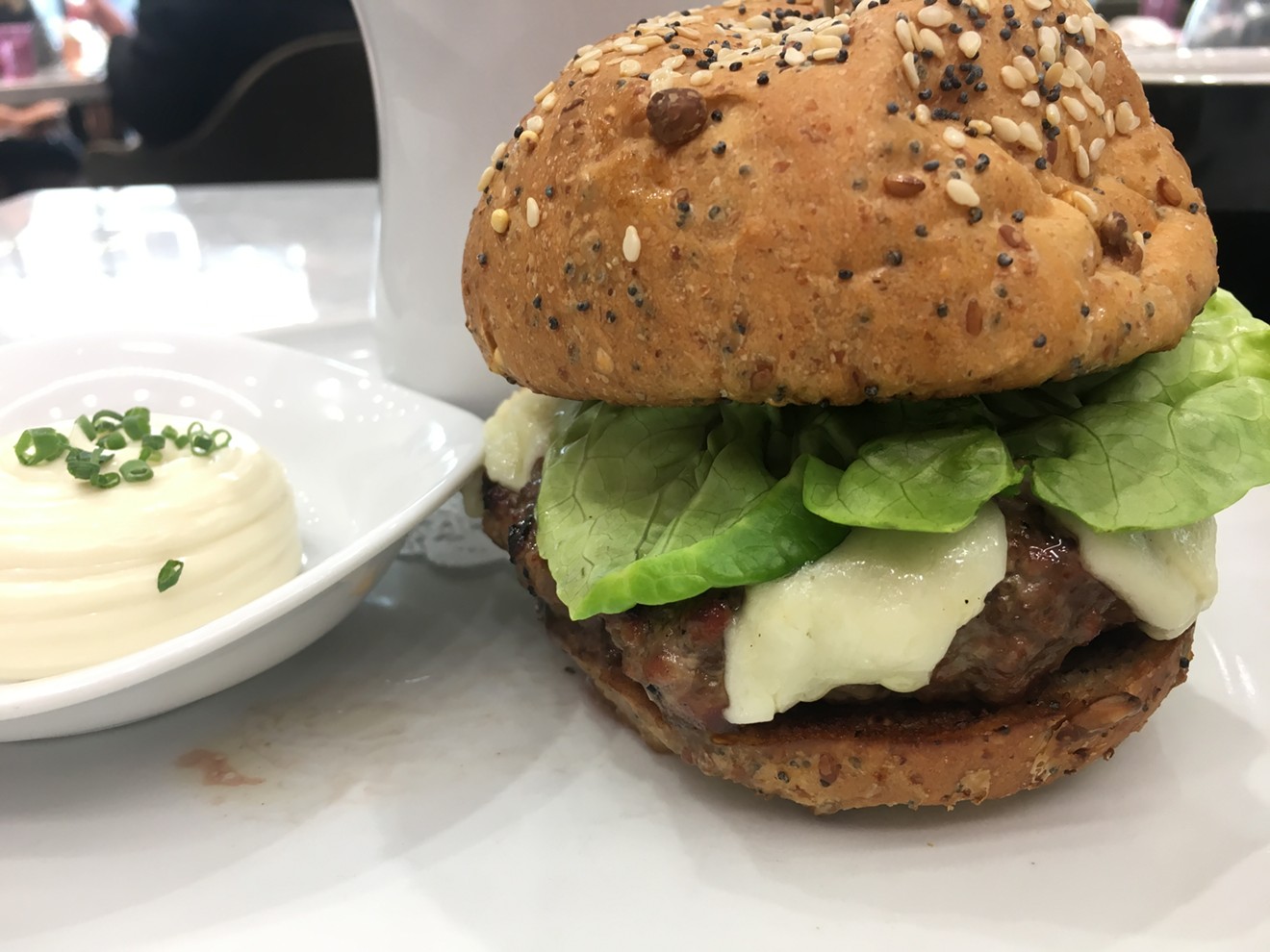 The humble (but not humbly priced) little burger, for lunch only, with sharp cheddar, pickled onions and gribiche sauce at Mirador for $16.