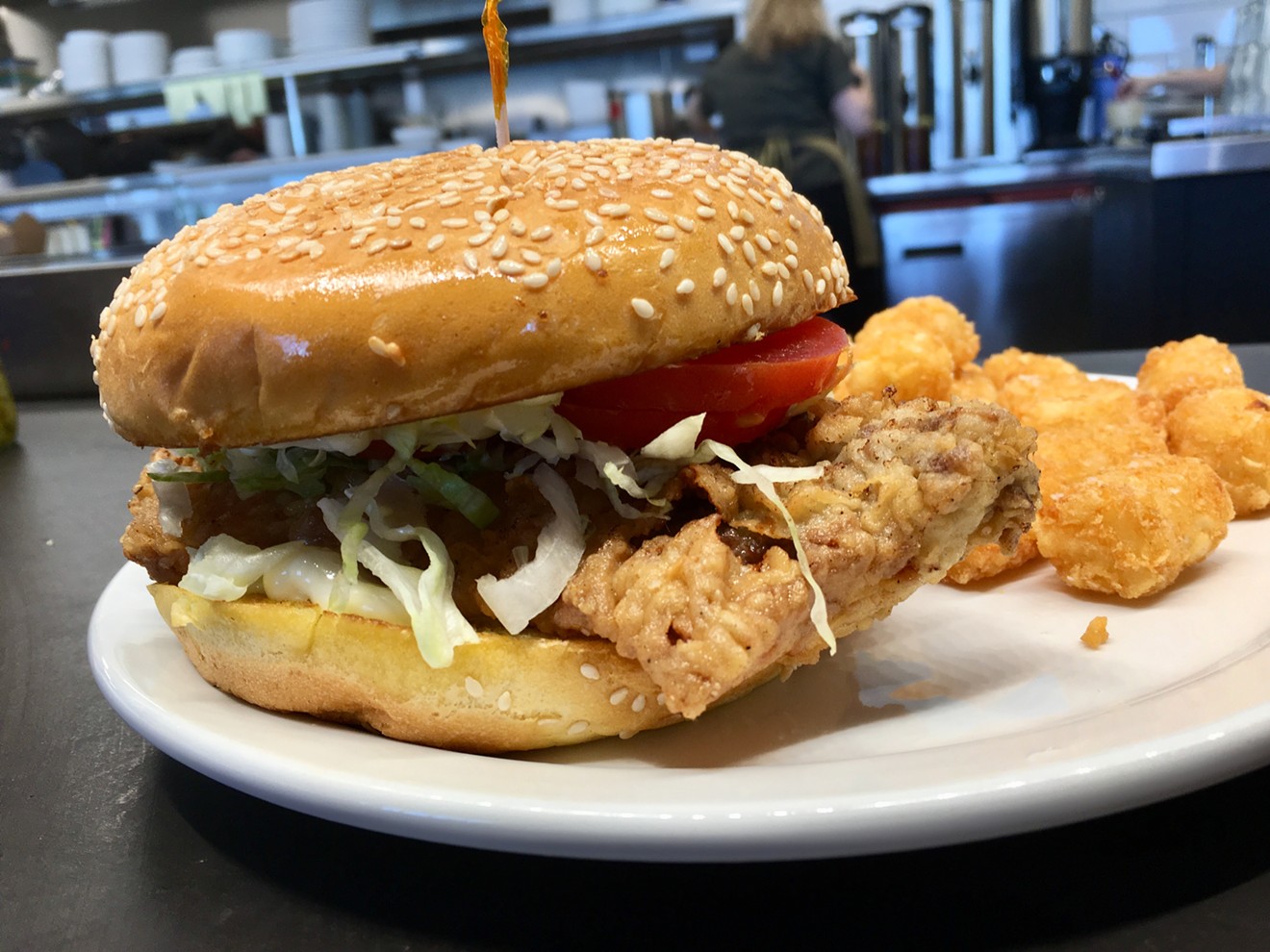 The chicken-fried steak sandwich, with shredded lettuce and tomatoes on a buttered sesame seed bun, is $8.99 at Mockingbird Diner.