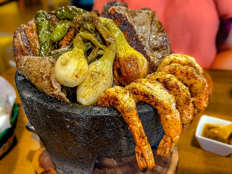 Image: Molcajete taquero: costillas asadas, tablitas, adobada, chorizo, camarones, nopales and jalapeño