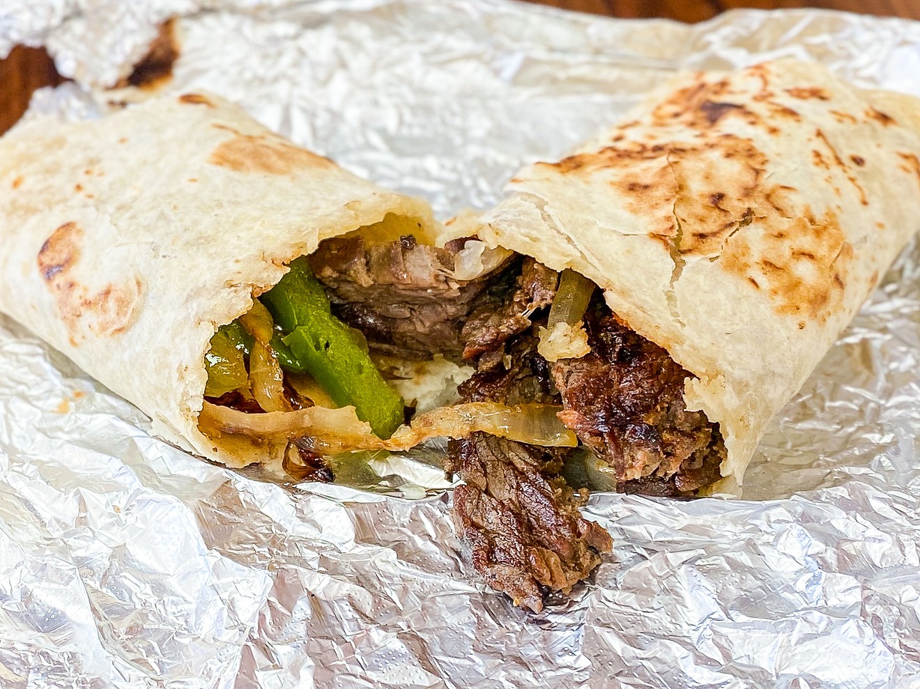 Beef fajita burrito with grilled onions and peppers