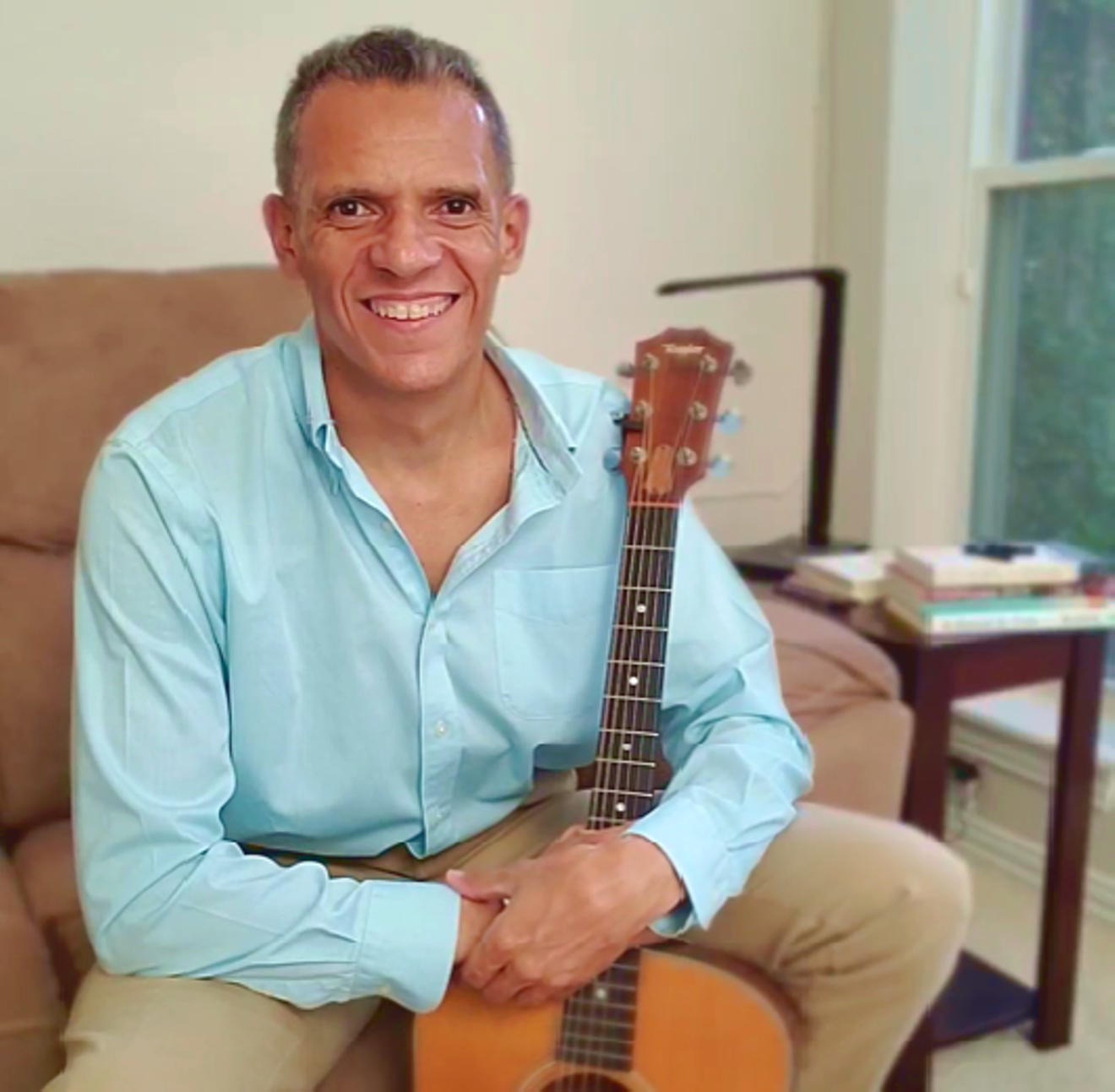 When he’s not campaigning for city council, JJ Fenceroy can be found strumming a guitar.
