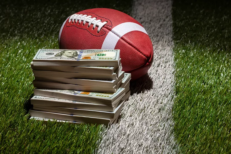 Image: College football and big bucks are more aligned than ever before.