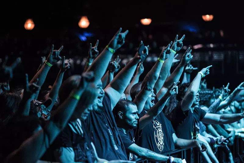Image: The guy in the middle is all of us as we watched the Black Eyed Peas.