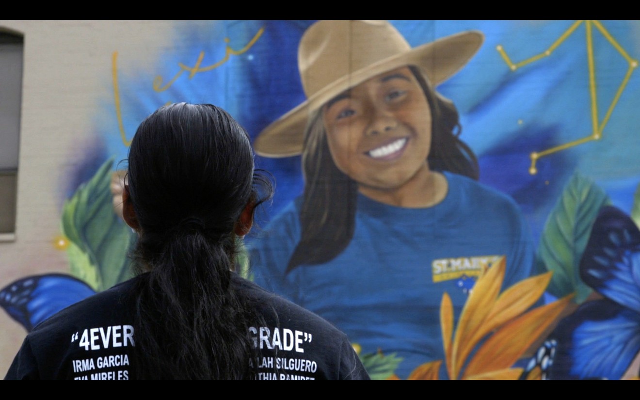 Kimberly Mata-Rubio stands in front a mural of her daughter, Lexi, in downtown Uvalde.