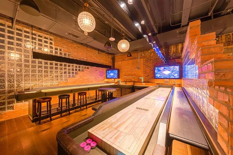 Image: The shuffleboards use technology that keeps track of each players' score.