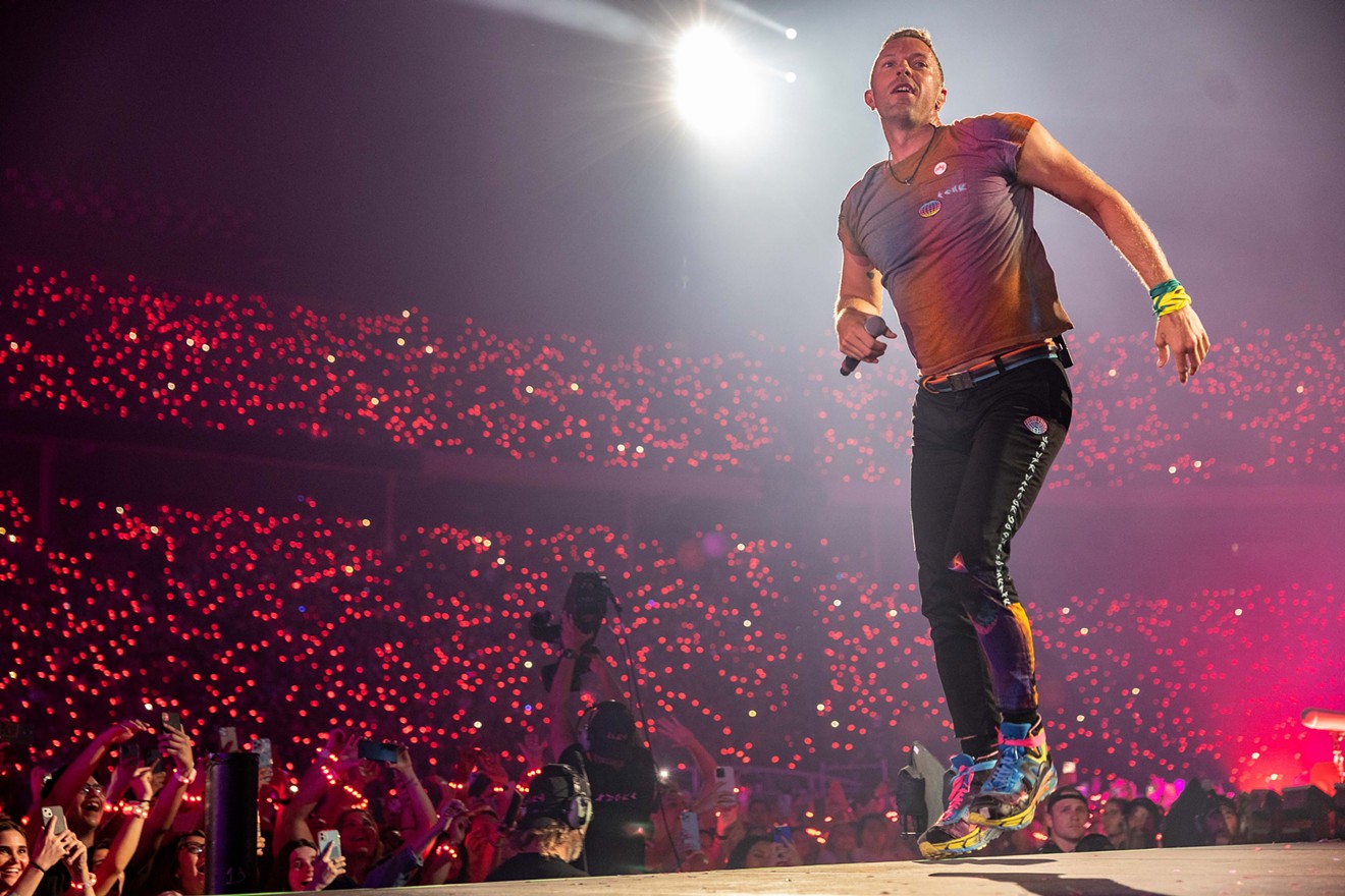 Coldplay's Chris Martin appears to levitate before a massive audience at the Cotton Bowl on Friday, May 6, 2022.