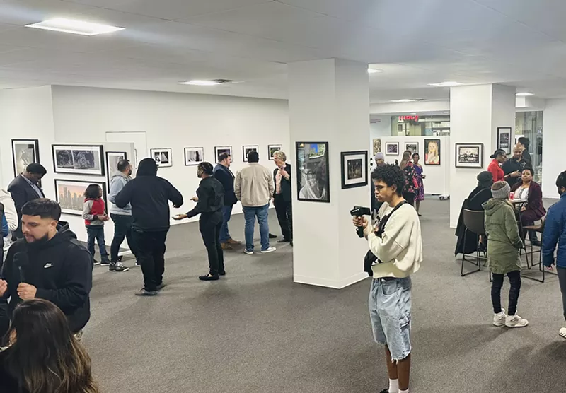 Image: Patrons check out art at A Decisive Vision: New Perspectives from Dallas College Faculty and Students, on display at the Adolphus Tower Gallery through March 29.