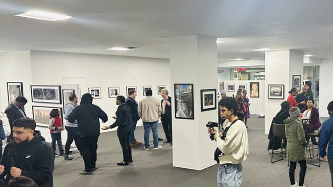Patrons check out art at A Decisive Vision: New Perspectives from Dallas College Faculty and Students, on display at the Adolphus Tower Gallery through March 29.
