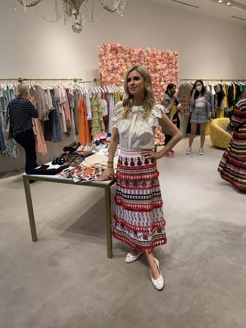 Image: Nicky Hilton poses in front of her shoe line at Alice + Olivia in Highland Park Village.