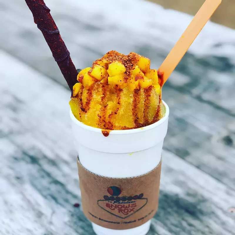 Image: The loaded mango margarita snowcone at Snow on the Rox comes with a drizzle of housemade chamoy.