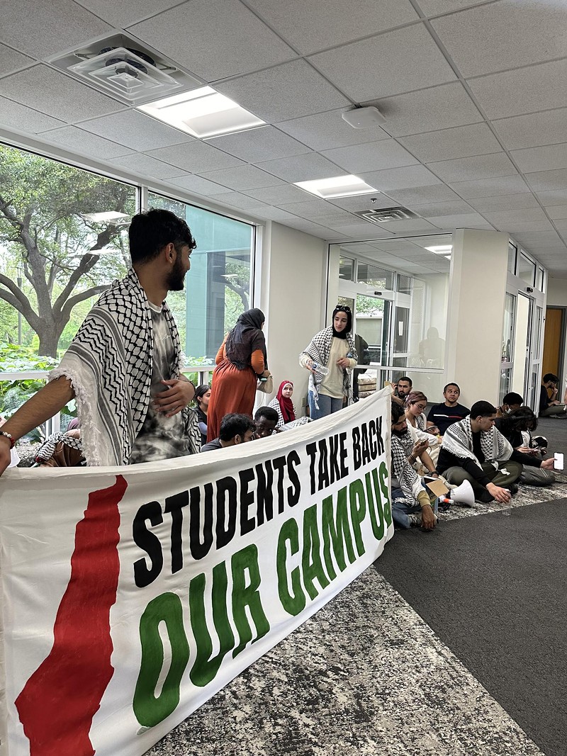 UT Dallas students sat in the hallway leading to UTD President Richard Benson's office for several hours Tuesday.