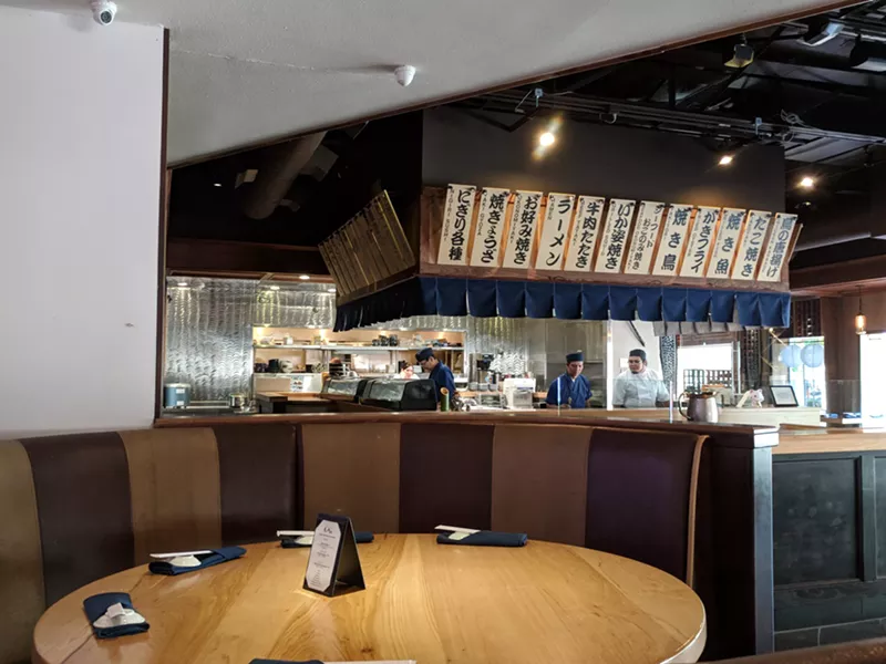 Image: Izakaya RoMan's open kitchen overlooks one of the two main dining areas.