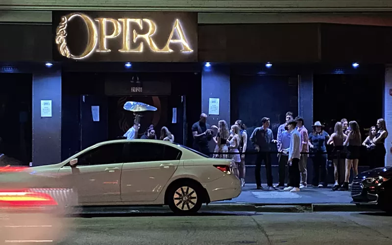 Image: A crowd waiting to go into Opera. Unlike the Phantom, they were maskless.