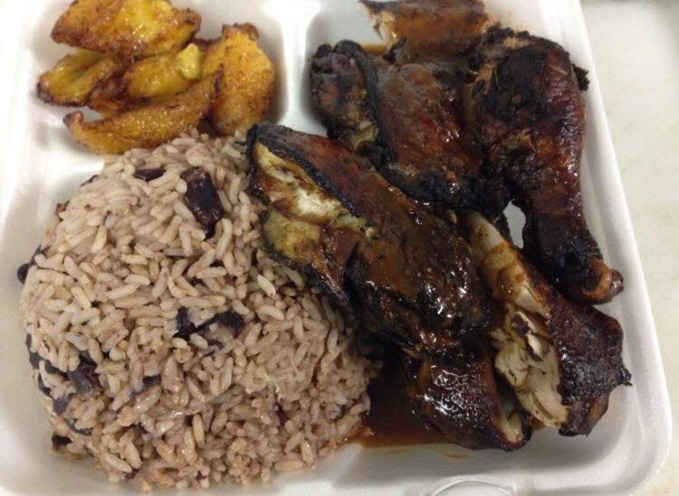 Jerk chicken with rice and plantains, one of several Jamaican dishes you'll find on the menu at One Love Lounge.