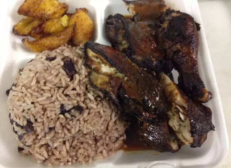 Image: Jerk chicken with rice and plantains, one of several Jamaican dishes you'll find on the menu at One Love Lounge.