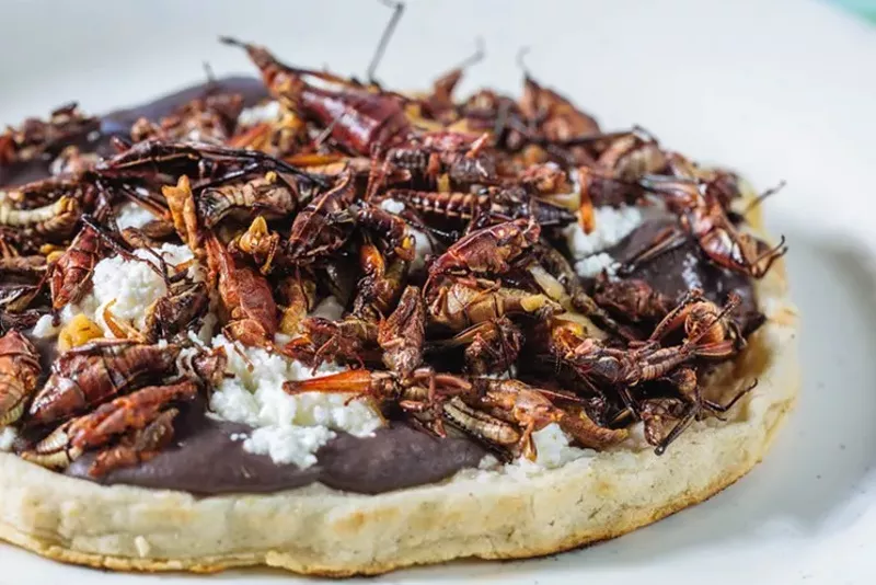 Image: The memelita with chapulines (grasshoppers) is one of many standout dishes at Mi Lindo Oaxaca, which is preparing to move into a space in the same block as Norma's Cafe.