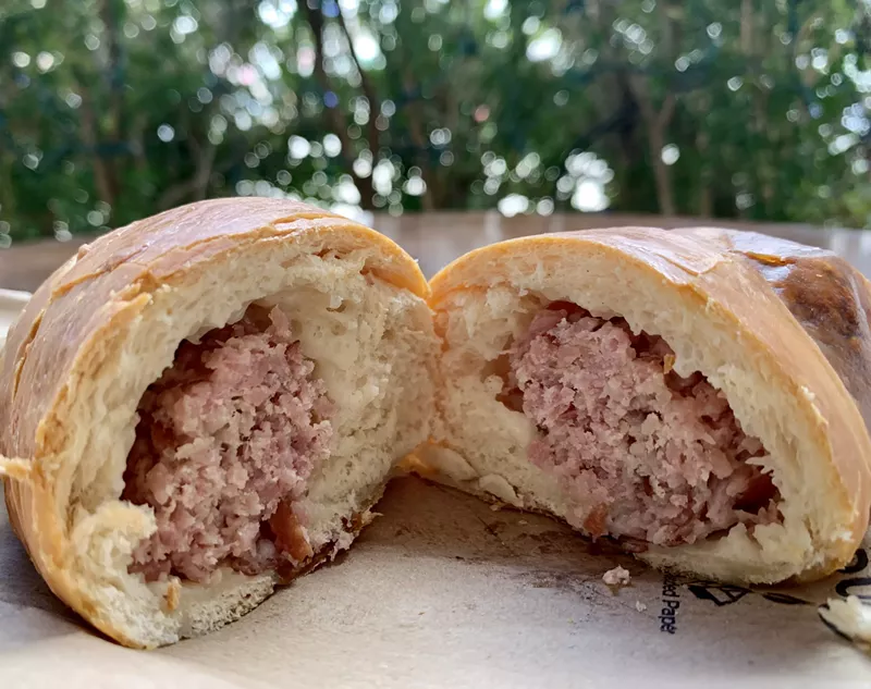 Image: Ham, cheese and nothing else, scooped into a house-made roll at Zaguán Latin Cafe.