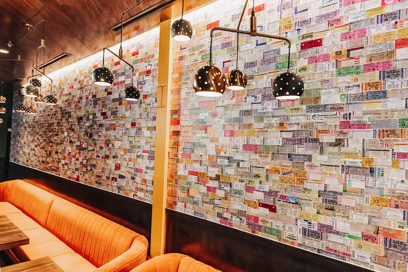 Image: The concert ticket wall at Postino in Deep Ellum.