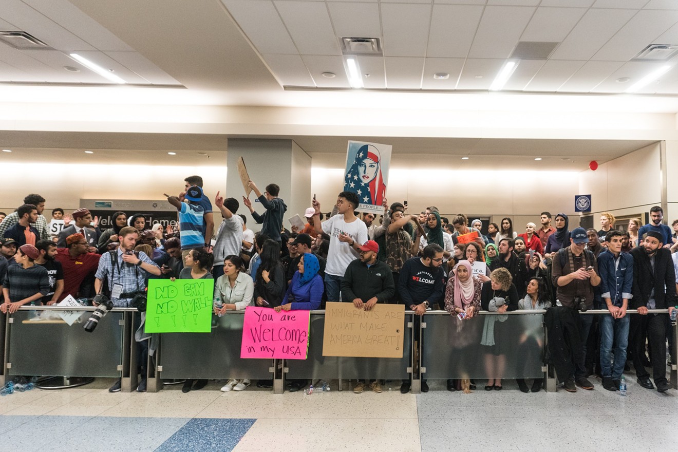 Protesters gather at DFW's Terminal D following the issuing of President Trump's travel ban.