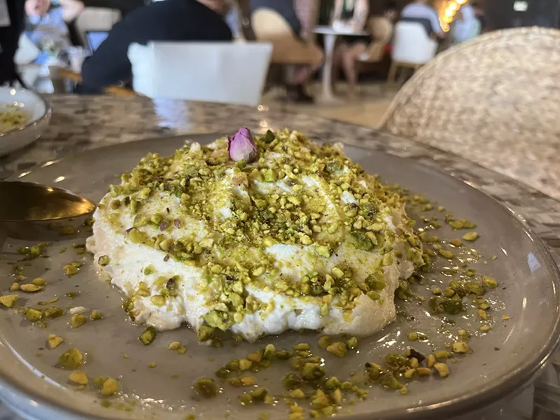 Image: The house-special, Madluka, is a typical Syrian sweet that comes with a base of semolina pudding garnished with cream and pistachios.