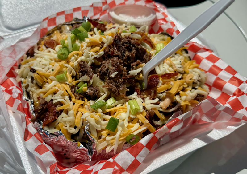 Image: This loaded baked potato has brisket, bacon cheese and butter.