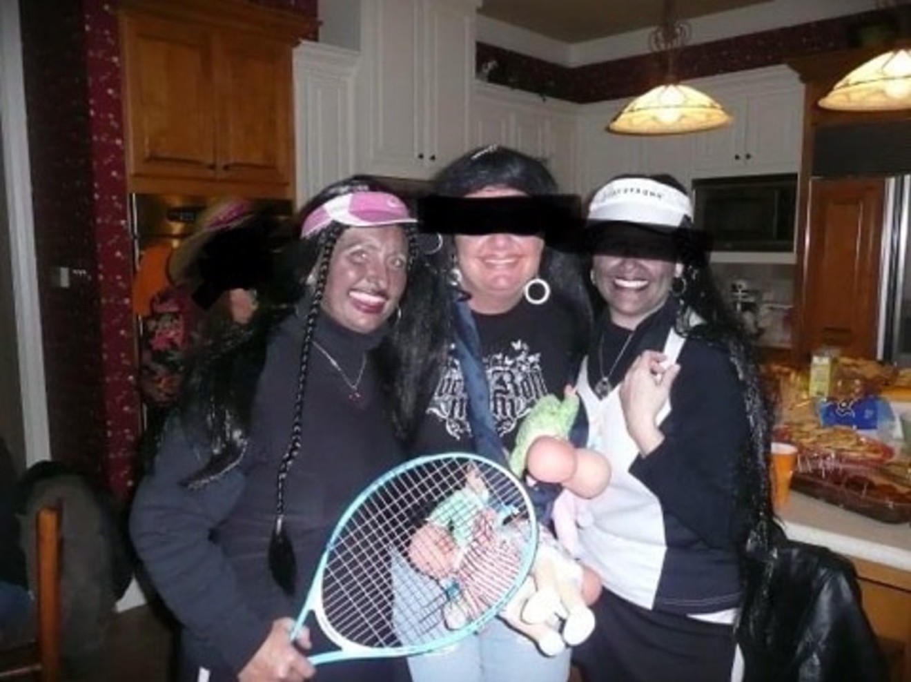 Midlothian ISD Board of Trustees member Tami Tobey, left, poses with two unidentified women at a Halloween party in 2012. Tobey, who is white, and another woman wore blackface as a part of their costumes.