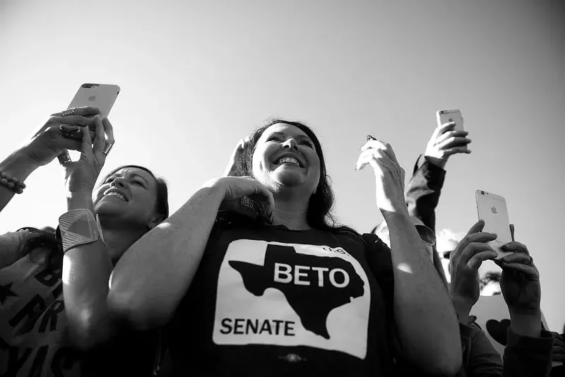 Image: Democrats cheer on candidates Beto O'Rourke and Colin Allred at a voter event in October.