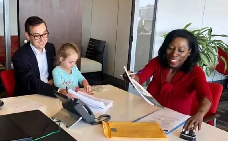 Image: Councilman Scott Griggs and City Secretary Bilirae Johnson share a happier moment at City Hall, though we're keeping an eye on that kid. She looks like trouble.