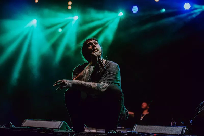 Image: Unlike other rappers who partied and played during the soggy day of music, Post Malone won the crowd's adoration and kept its attention during the entire show.