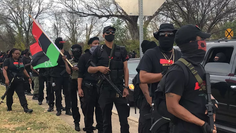 Image: Armed members of various Huey P. Newton Gun Club chapters prepare to patrol in South Dallas.
