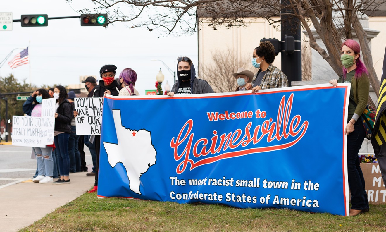 PRO Gainesville unveiled a new banner at Friday's protest.