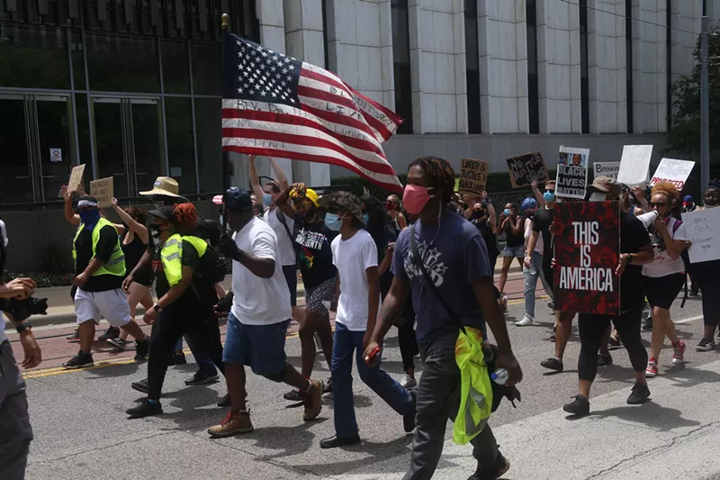 Image: Police brutality protesters marched through the streets of Dallas on July 4.