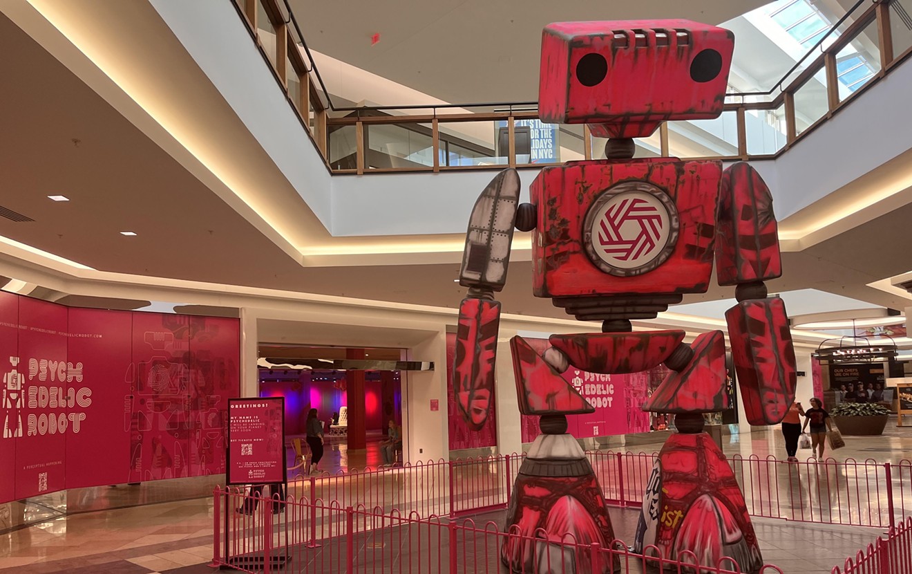 The entrance to the new Psychedelic Robot exhibition at The Shops at Willow Bend is guarded by a life size sculpture of the robot built by local sculptor Johnney Edwards.